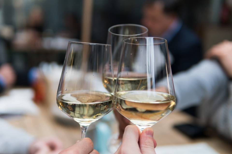 Three glasses in a toast